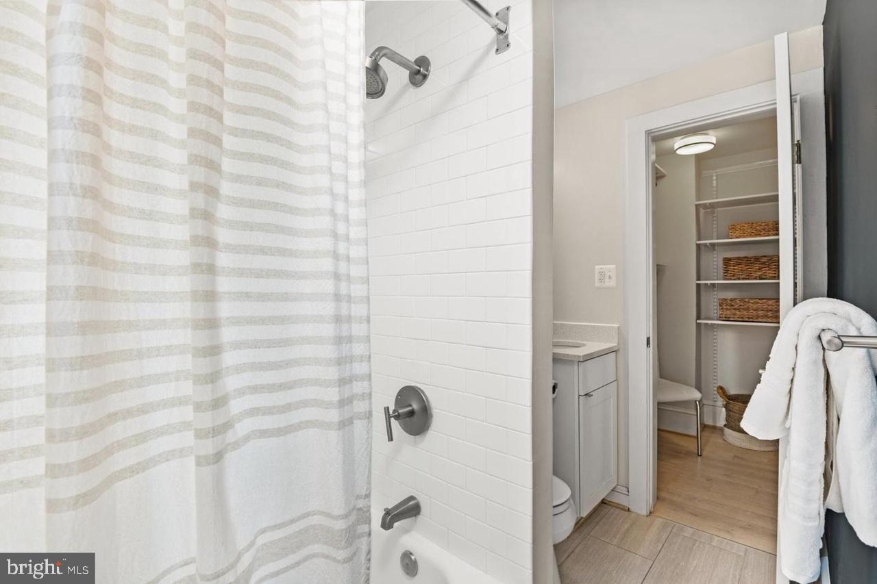 1451 Park Road Northwest, Unit 220 Washington, DC 20010 - Photo 16 of 30 a bathroom with a shower and a glass door