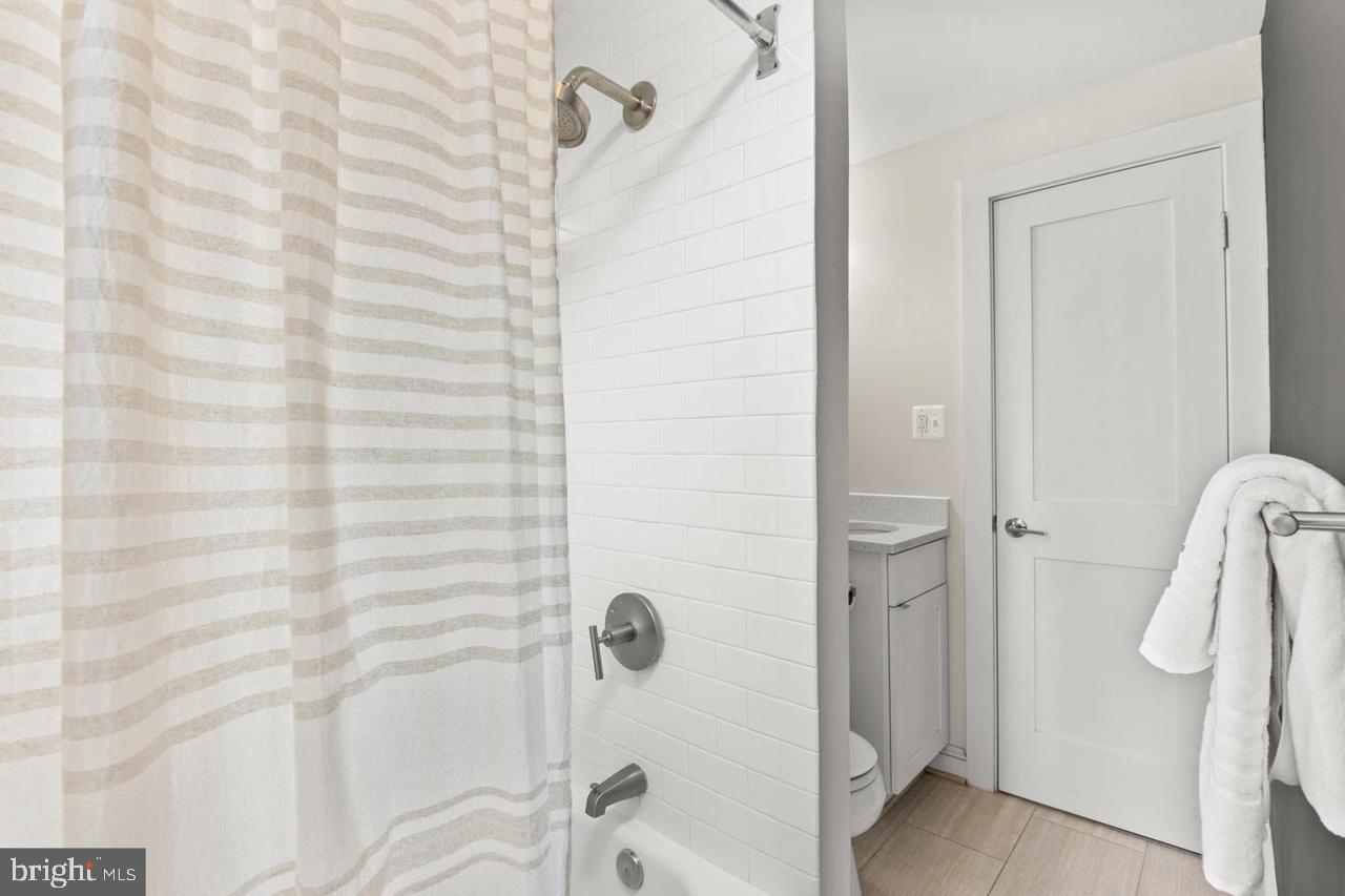 1451 Park Road Northwest, Unit 220 Washington, DC 20010 - Photo 17 of 30 a bathroom with a shower