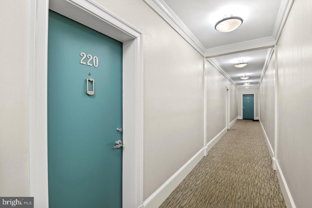 1451 Park Road Northwest, Unit 220 Washington, DC 20010 - Photo 22 of 30 a view of hallway with stairs