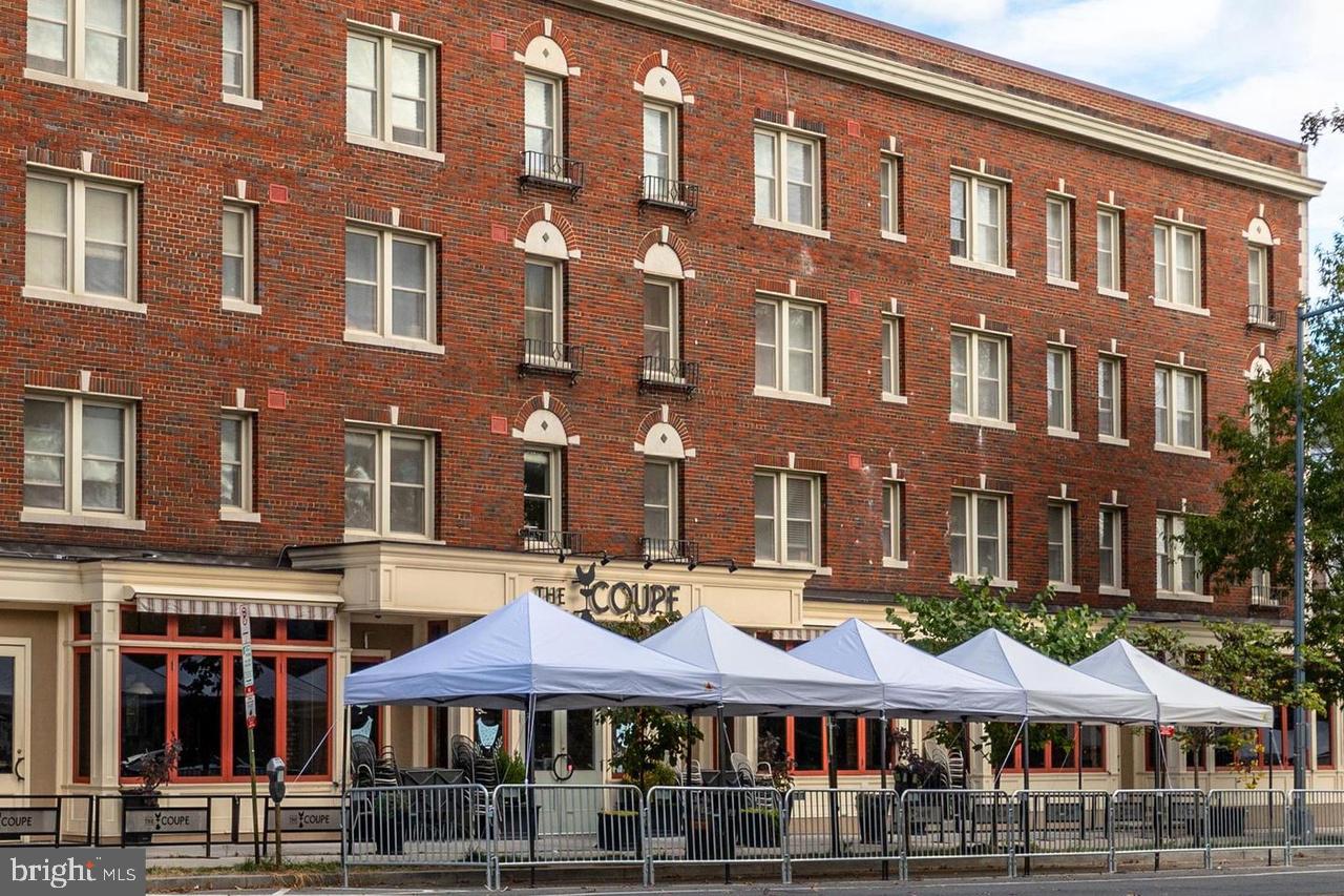 1451 Park Road Northwest, Unit 220 Washington, DC 20010 - Photo 25 of 30 a view of a building with a swimming pool