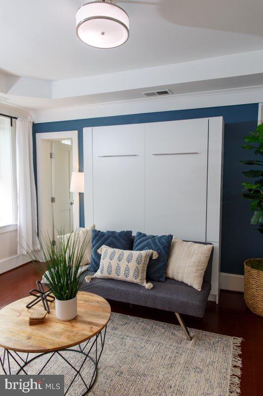 1451 Park Road Northwest, Unit 220 Washington, DC 20010 - Photo 10 of 30 a living room with furniture and a potted plant
