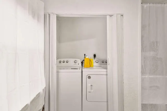 a utility room with dryer and washer