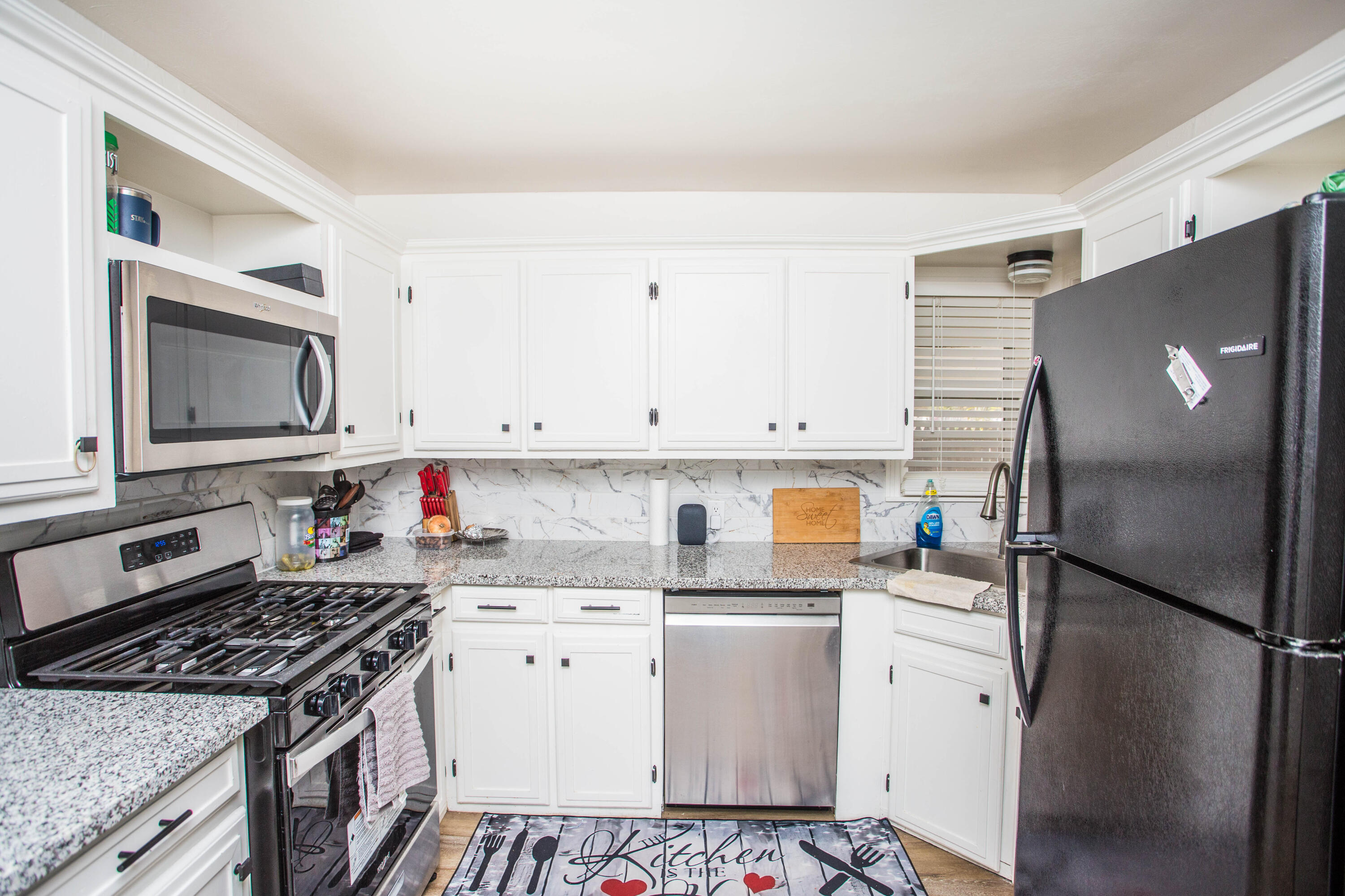 2604 39th Street Lubbock, TX 79413 - Photo 13 of 43 a kitchen with a refrigerator sink and stove