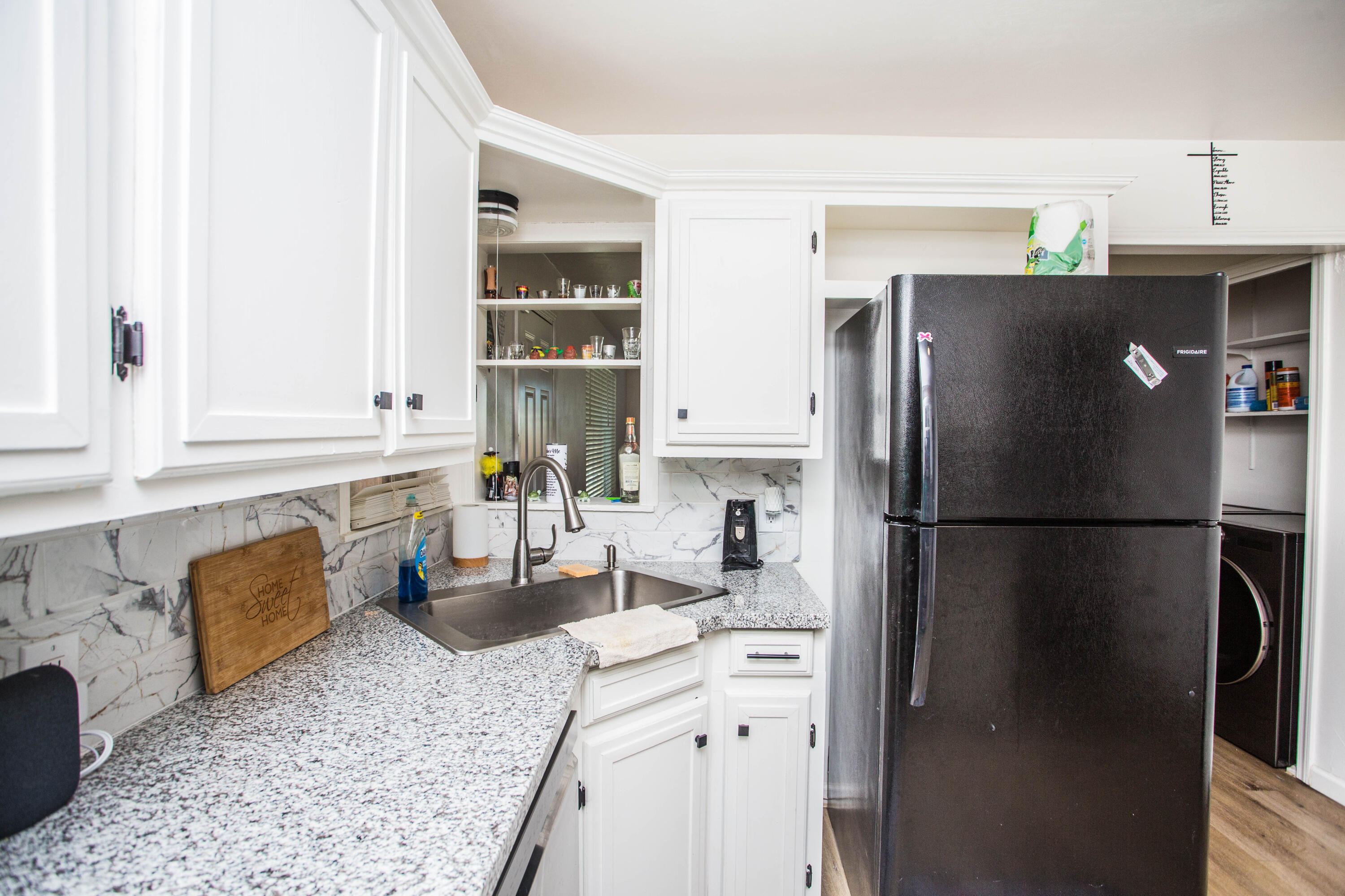 2604 39th Street Lubbock, TX 79413 - Photo 14 of 43 a kitchen with stainless steel appliances granite countertop a refrigerator a stove and a sink