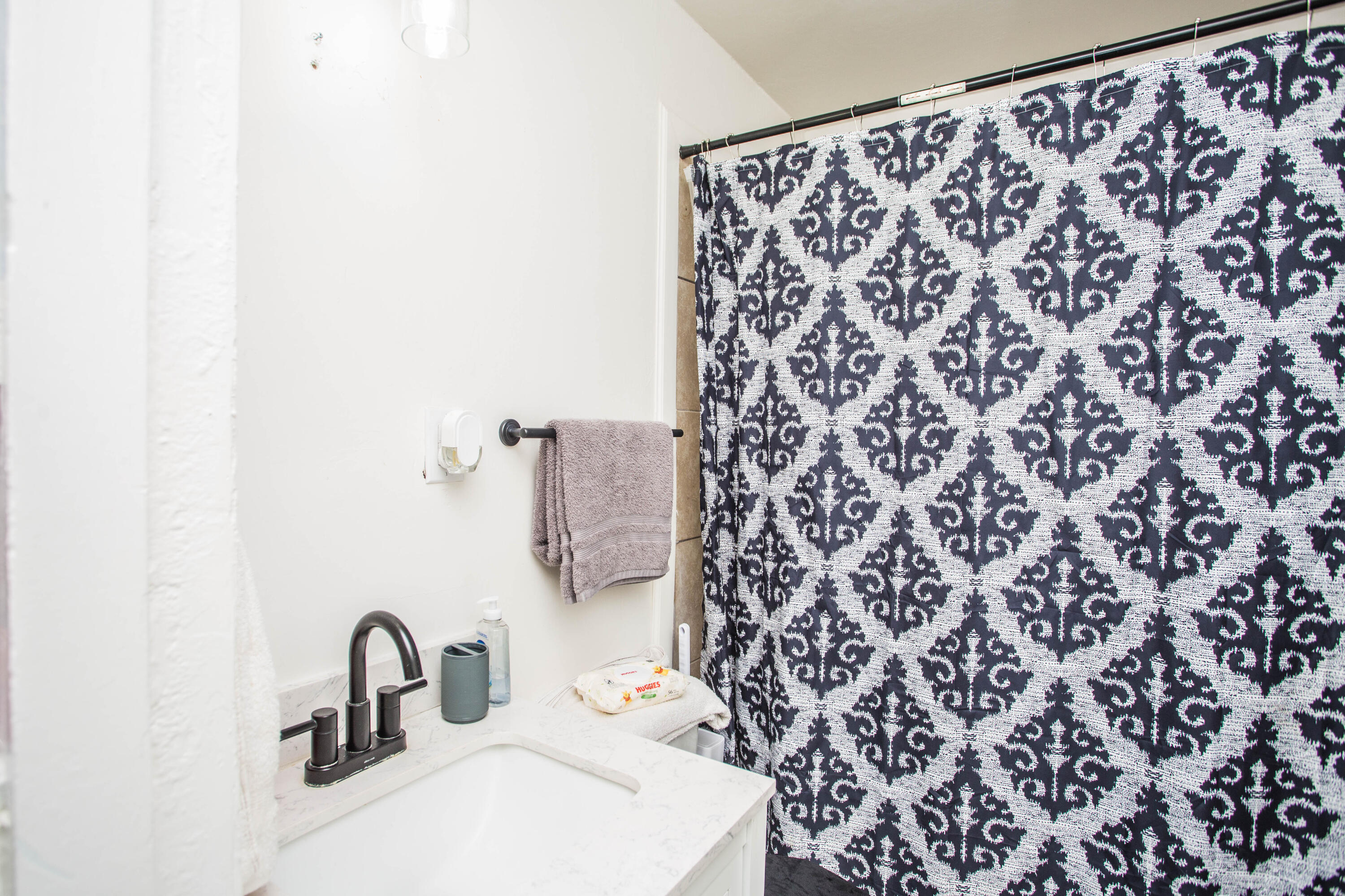 2604 39th Street Lubbock, TX 79413 - Photo 18 of 43 a bathroom with a sink and a mirror
