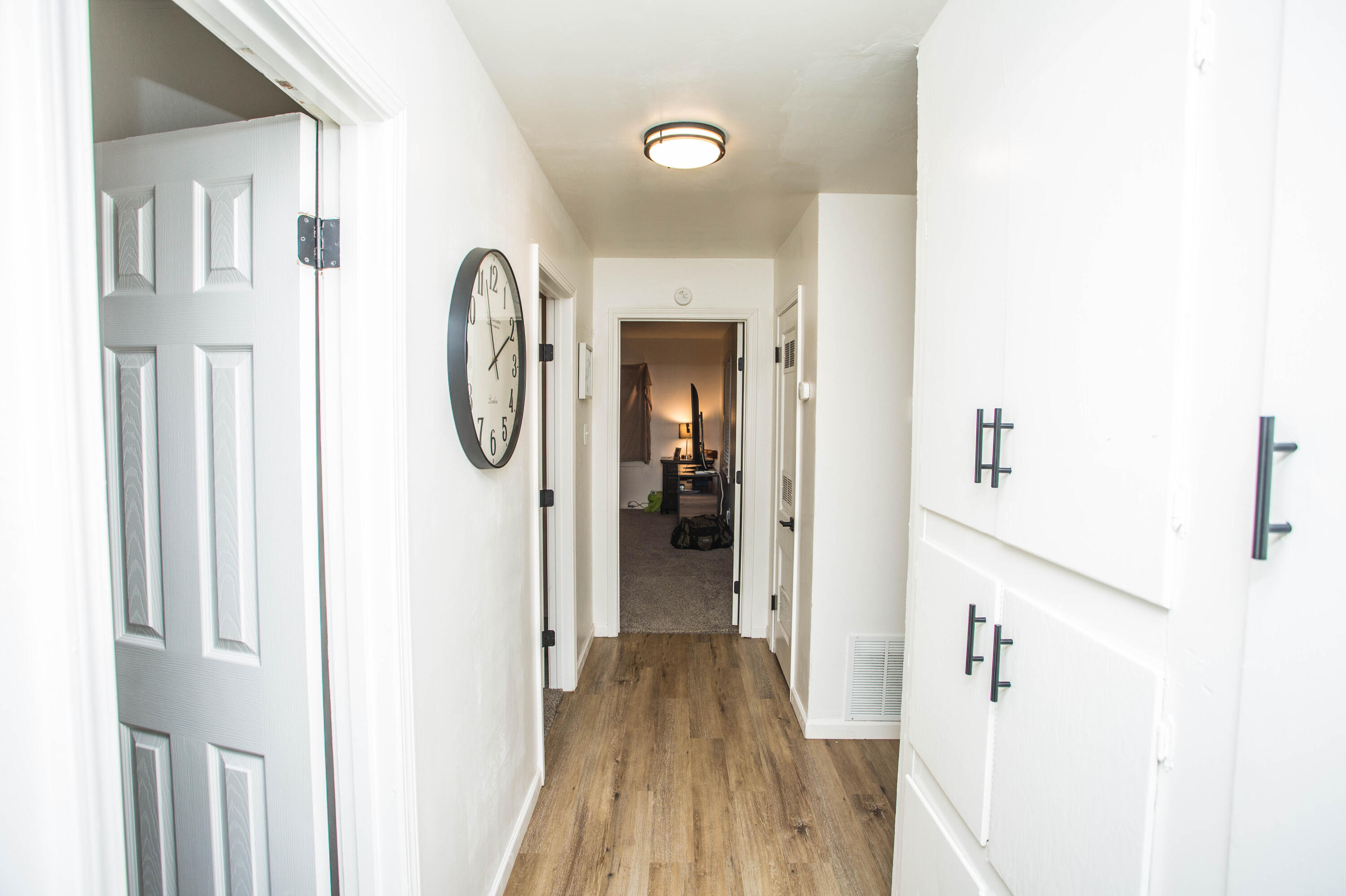 2604 39th Street Lubbock, TX 79413 - Photo 22 of 43 a view of a hallway with wooden floor