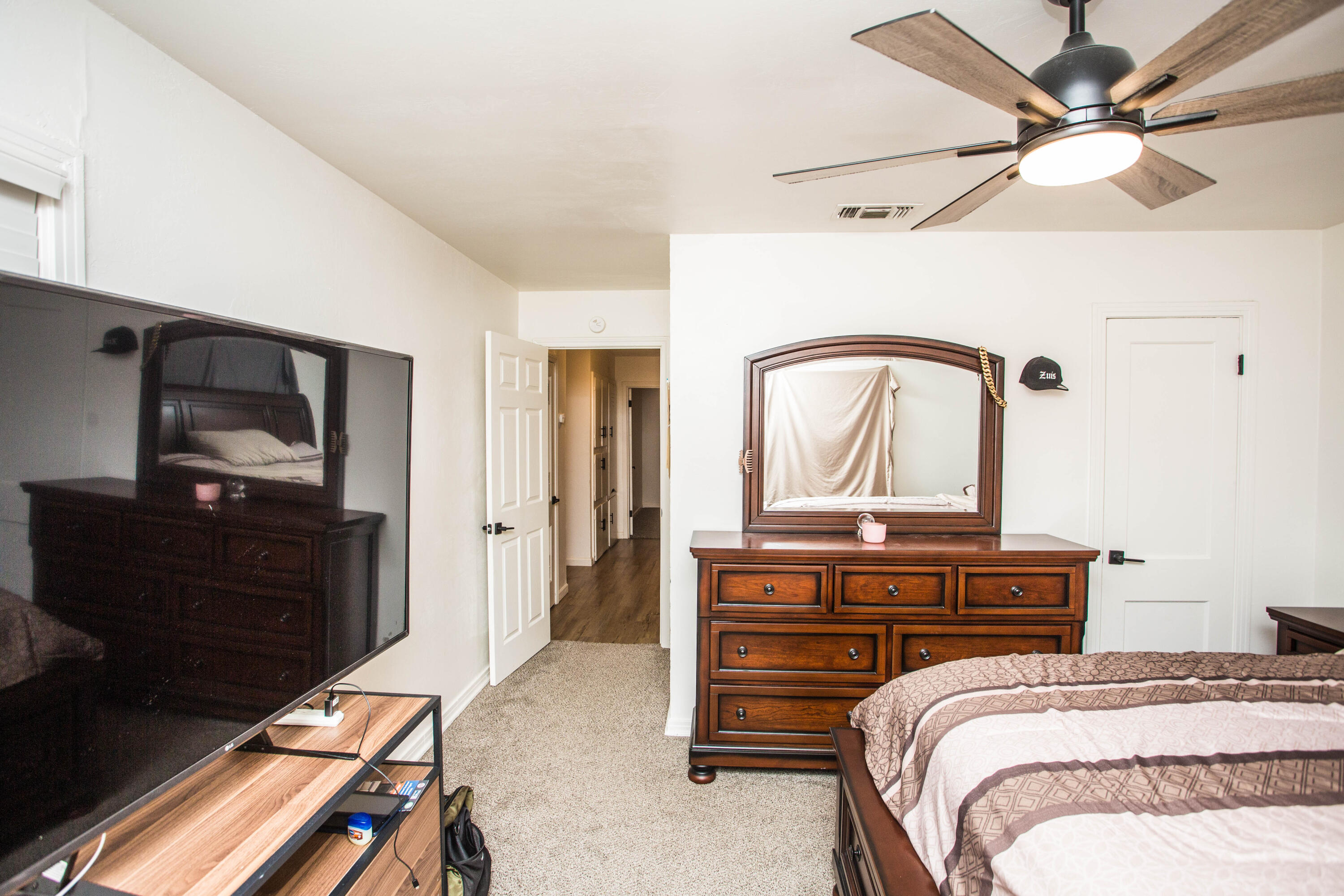 2604 39th Street Lubbock, TX 79413 - Photo 28 of 43 a bedroom with a bed and a dresser