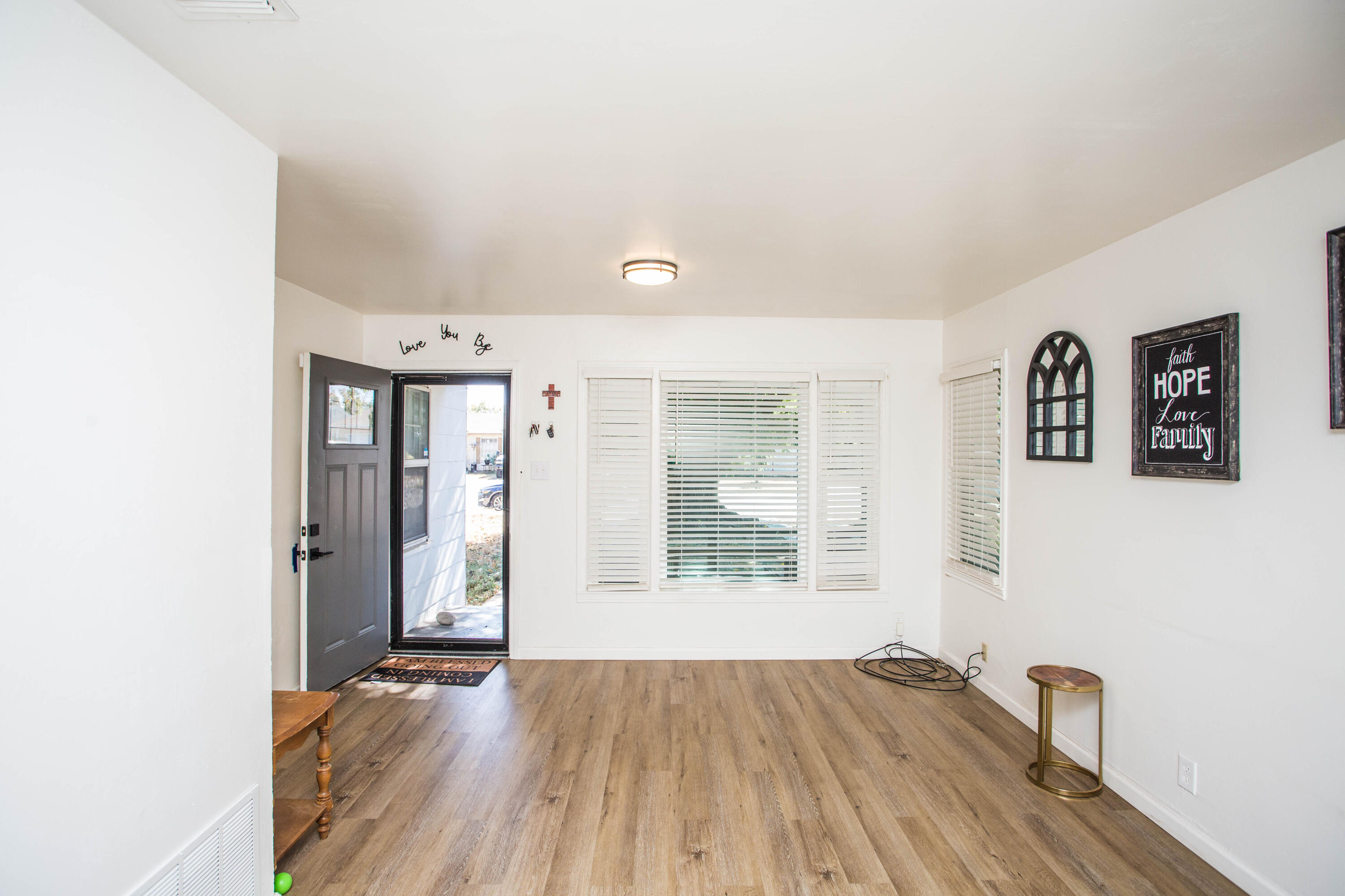 2604 39th Street Lubbock, TX 79413 - Photo 30 of 43 an empty room with wooden floor and windows