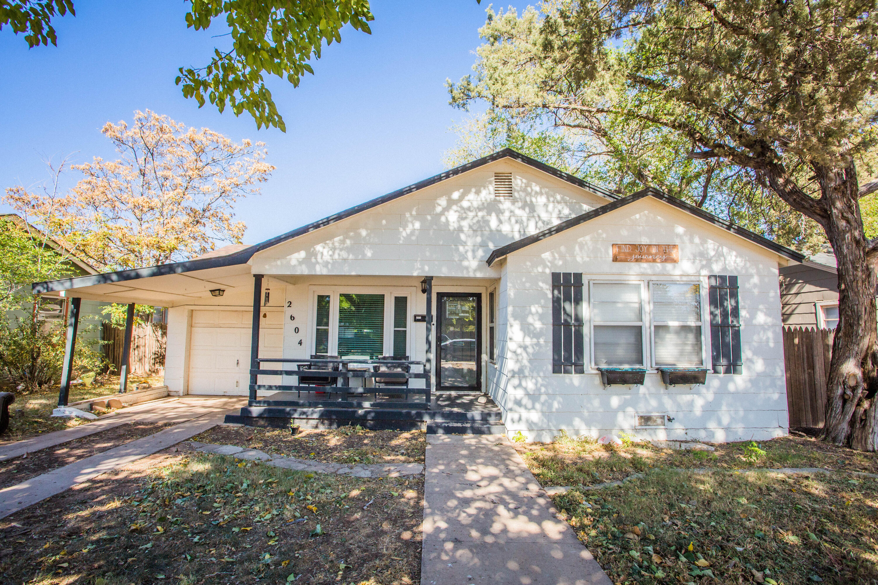 2604 39th Street Lubbock, TX 79413 - Photo 3 of 43 a front view of a house with garden