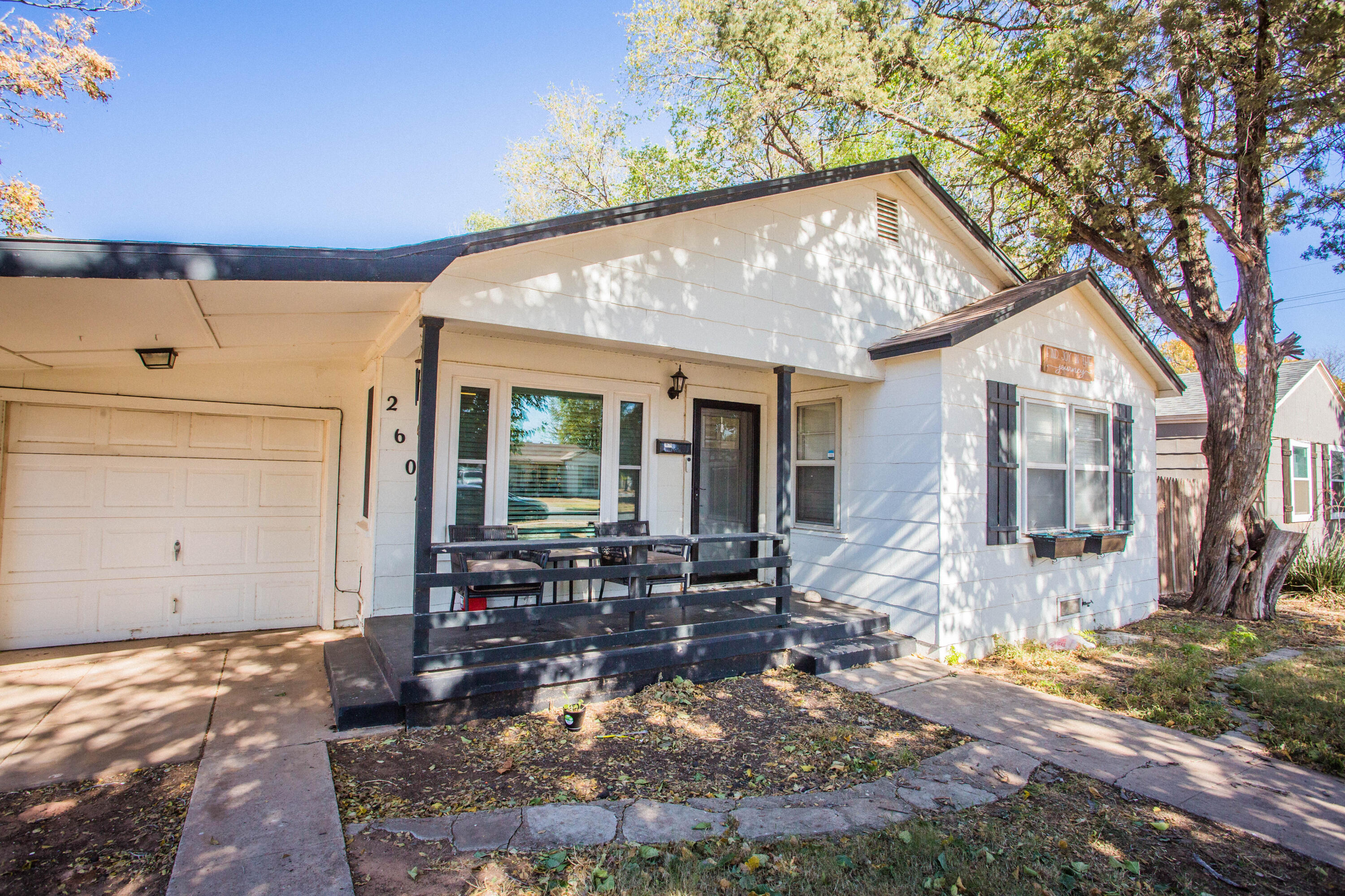 2604 39th Street Lubbock, TX 79413 - Photo 42 of 43 a front view of house with yard outdoor seating and barbeque oven