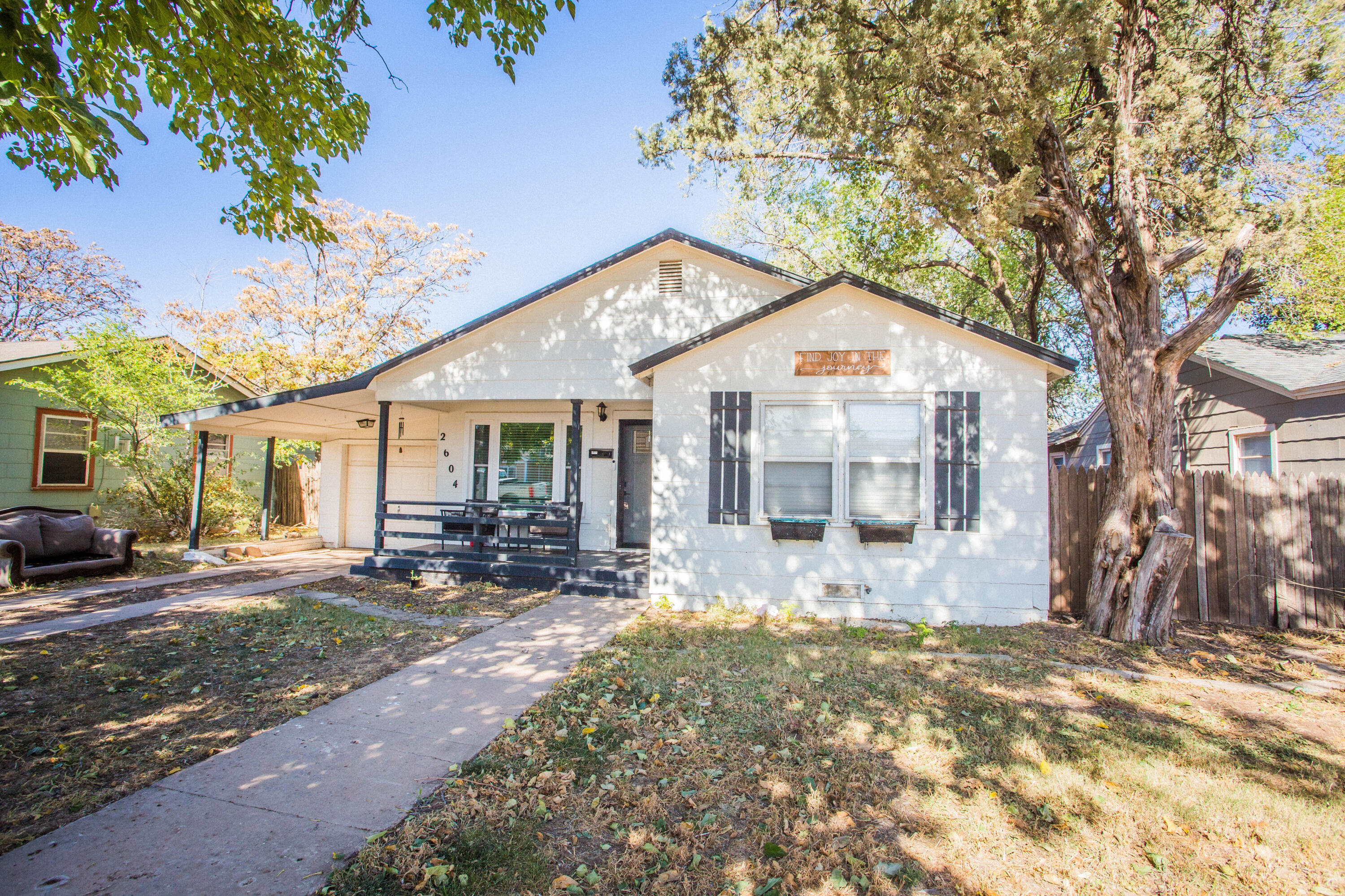 2604 39th Street Lubbock, TX 79413 - Photo 43 of 43 a front view of a house with a yard and outdoor seating