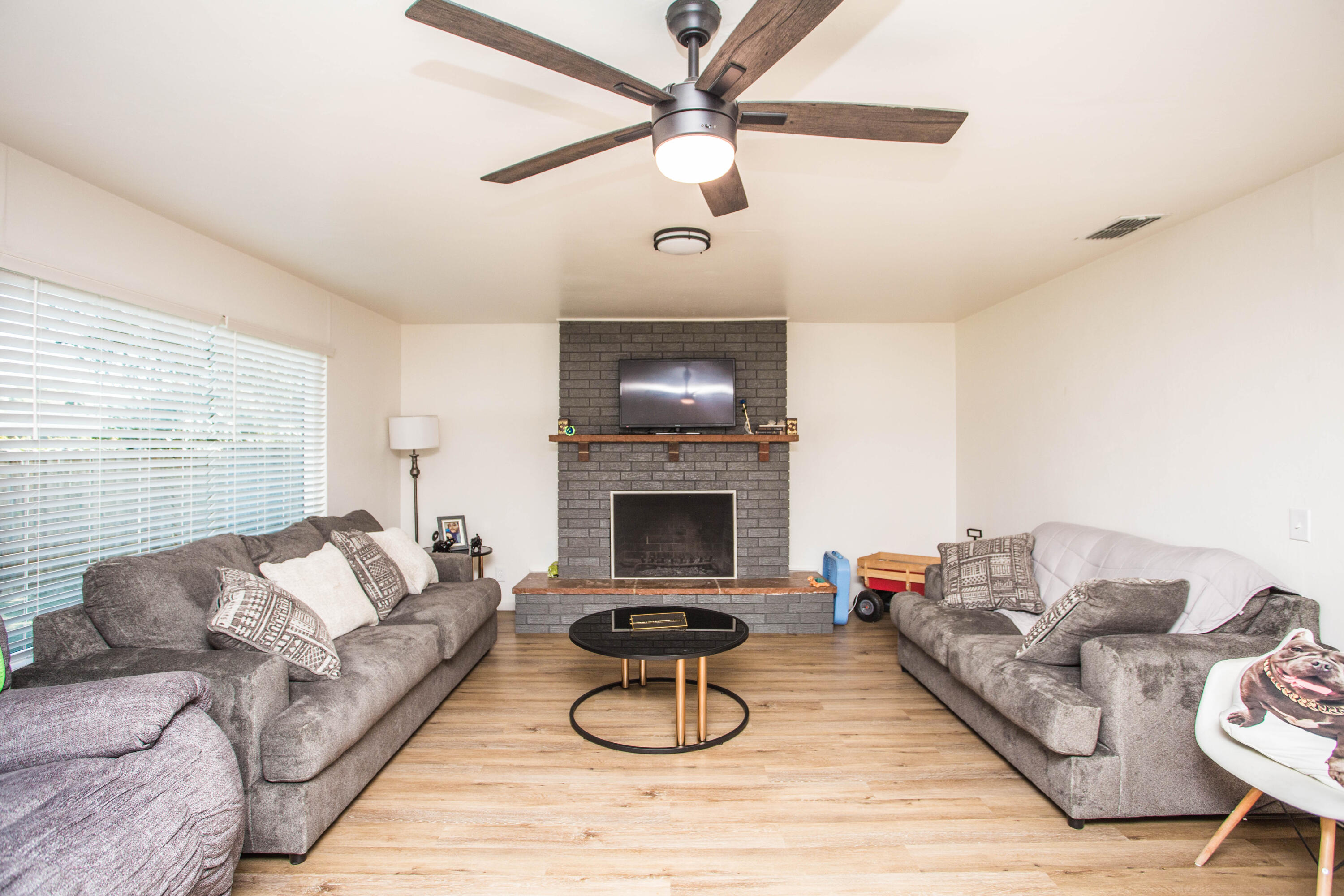 2604 39th Street Lubbock, TX 79413 - Photo 7 of 43 a living room with furniture a rug and a fireplace