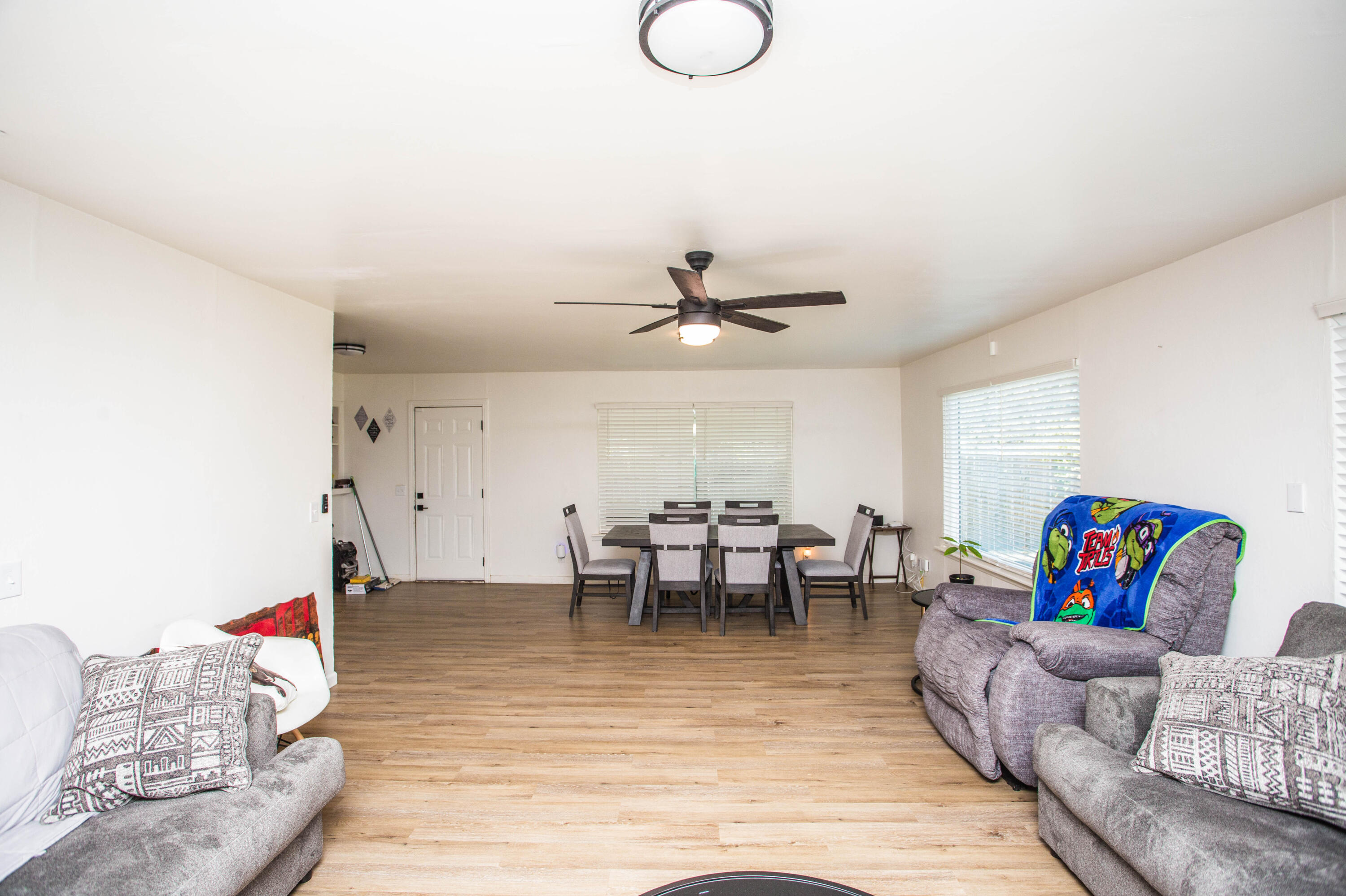 2604 39th Street Lubbock, TX 79413 - Photo 8 of 43 a living room with furniture and a dining table