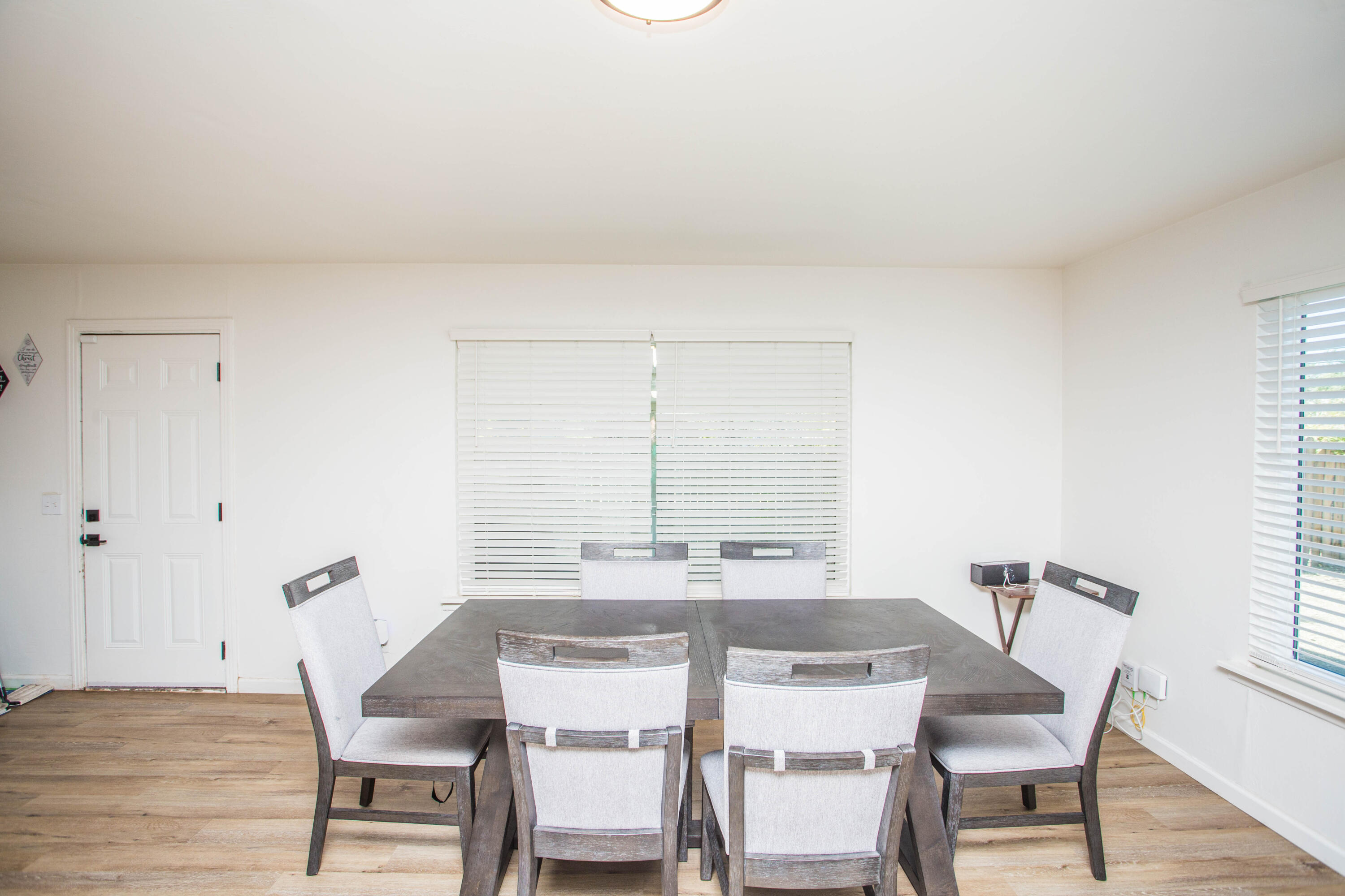2604 39th Street Lubbock, TX 79413 - Photo 9 of 43 a view of a dining room with furniture and wooden floor