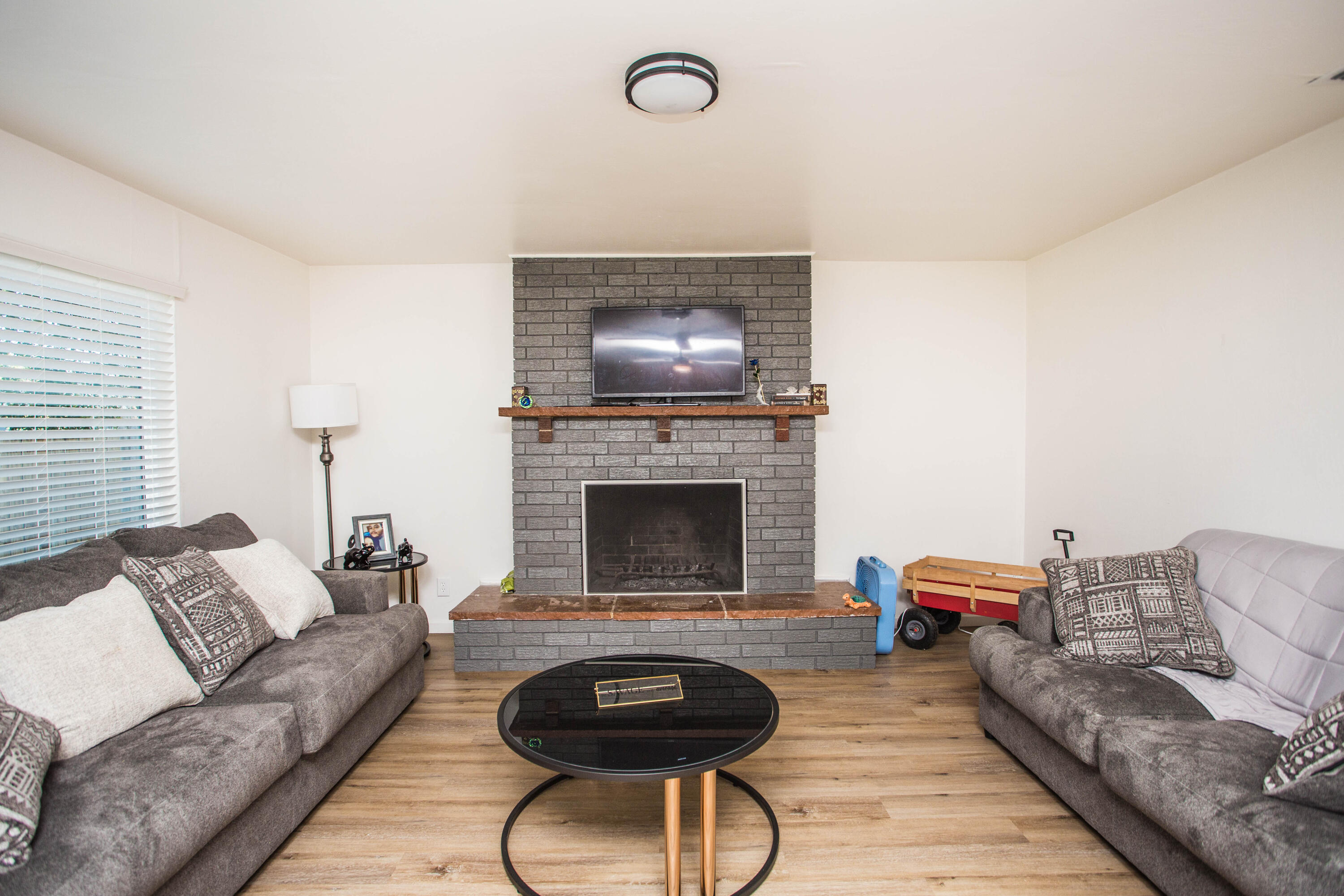 2604 39th Street Lubbock, TX 79413 - Photo 10 of 43 a living room with furniture and a fireplace
