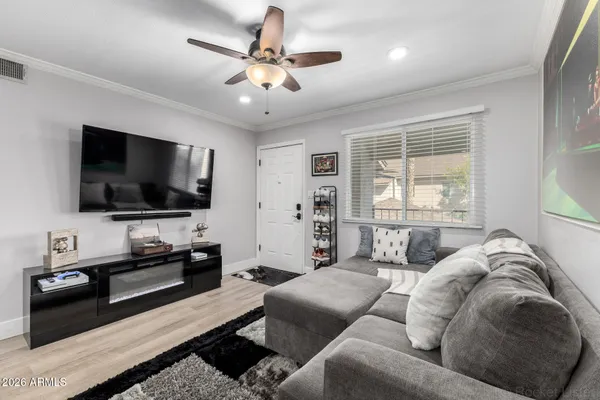 a living room with furniture and a flat screen tv