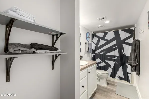 a view of an entryway with wooden floor