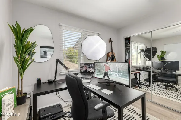 a view of a dining room with furniture and a potted plant
