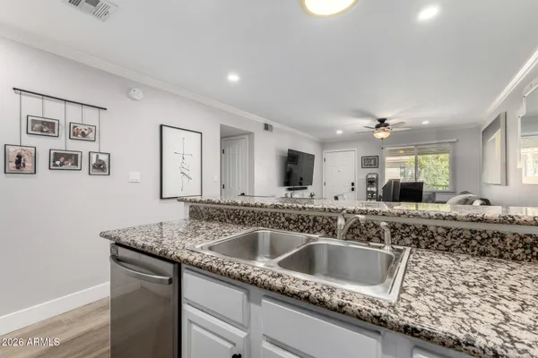 a kitchen with a sink and a refrigerator