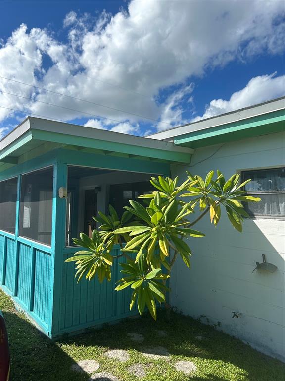 461 South Brevard Avenue, Unit 18 Cocoa Beach, FL 32931 - Photo 1 of 24 a vase of flowers sitting on a table