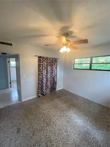 a view of empty room with windows