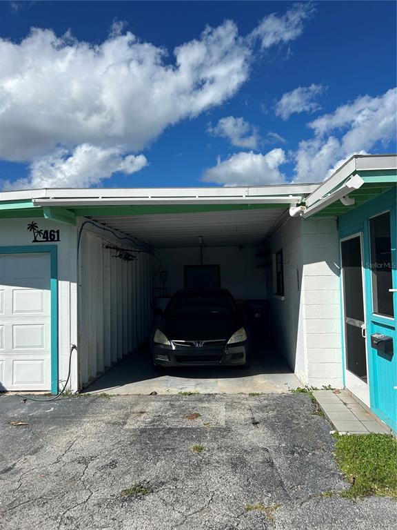 461 South Brevard Avenue, Unit 18 Cocoa Beach, FL 32931 - Photo 18 of 24 a view of a car garage