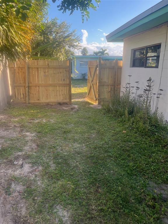 461 South Brevard Avenue, Unit 18 Cocoa Beach, FL 32931 - Photo 19 of 24 a view of a backyard