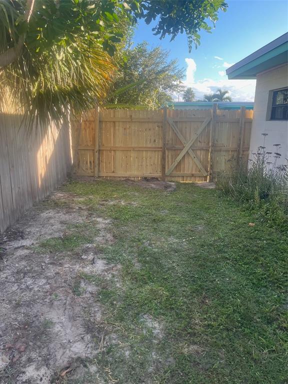 461 South Brevard Avenue, Unit 18 Cocoa Beach, FL 32931 - Photo 20 of 24 a view of a backyard