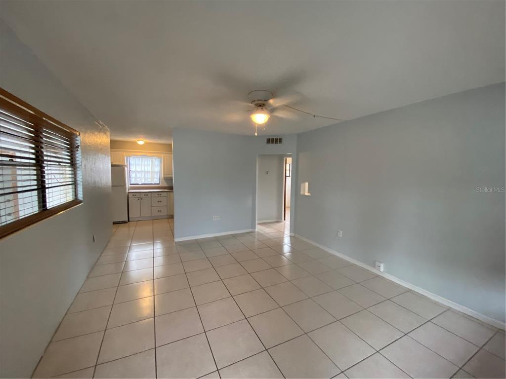 461 South Brevard Avenue, Unit 18 Cocoa Beach, FL 32931 - Photo 7 of 24 a view of an empty room and window in a room