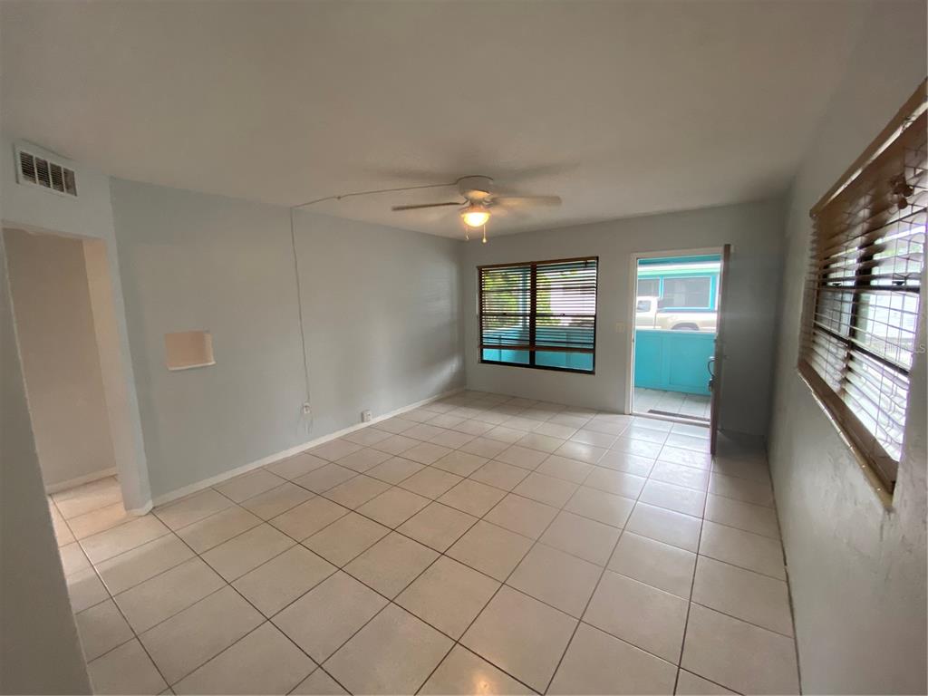 461 South Brevard Avenue, Unit 18 Cocoa Beach, FL 32931 - Photo 9 of 24 a view of an empty room with a window