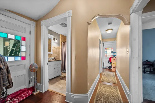 a bedroom with bed and a window