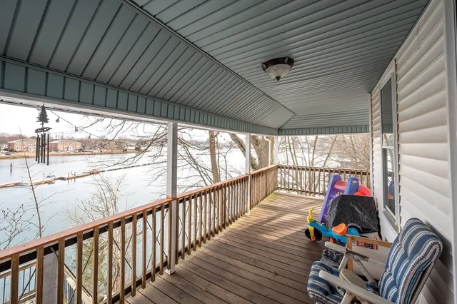 a front view of a house with outdoor seating