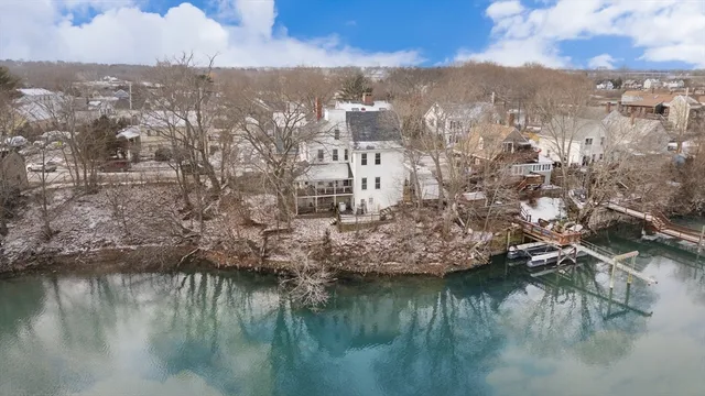 a view of a lake in middle of forest