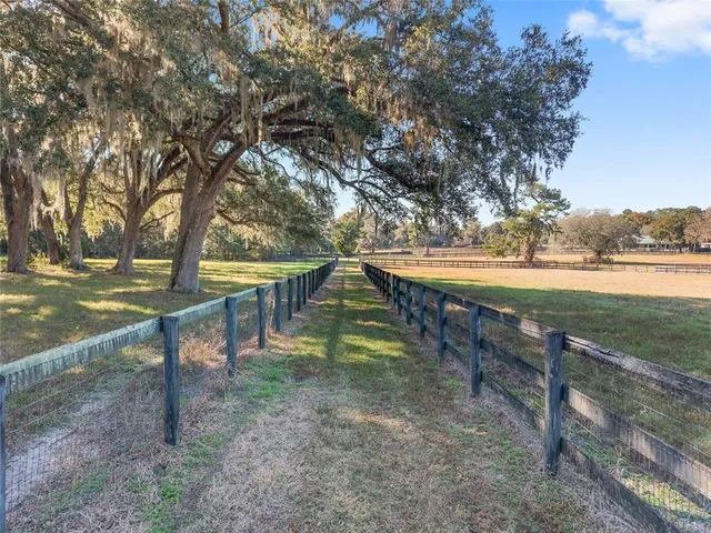 a view of outdoor space with deck and yard