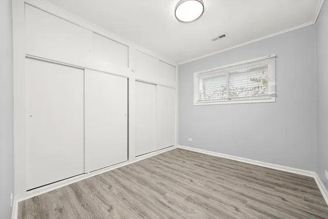 a view of room with wooden floor