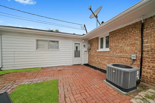 a backyard of a house with seating space