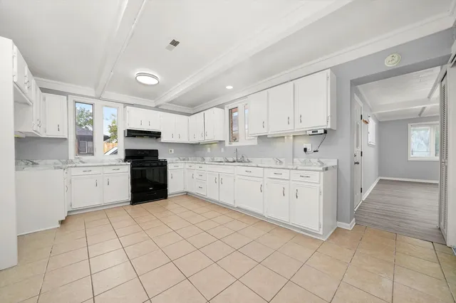 a kitchen with appliances cabinets and a sink