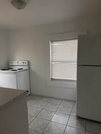 a view of a kitchen with a sink dishwasher and a microwave oven