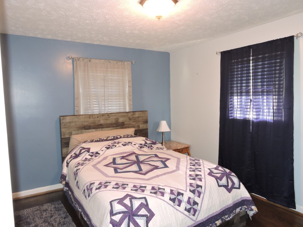 166 Sixteenth Model Road Manchester, TN 37355 - Photo 8 of 17 a bedroom with a bed and a window