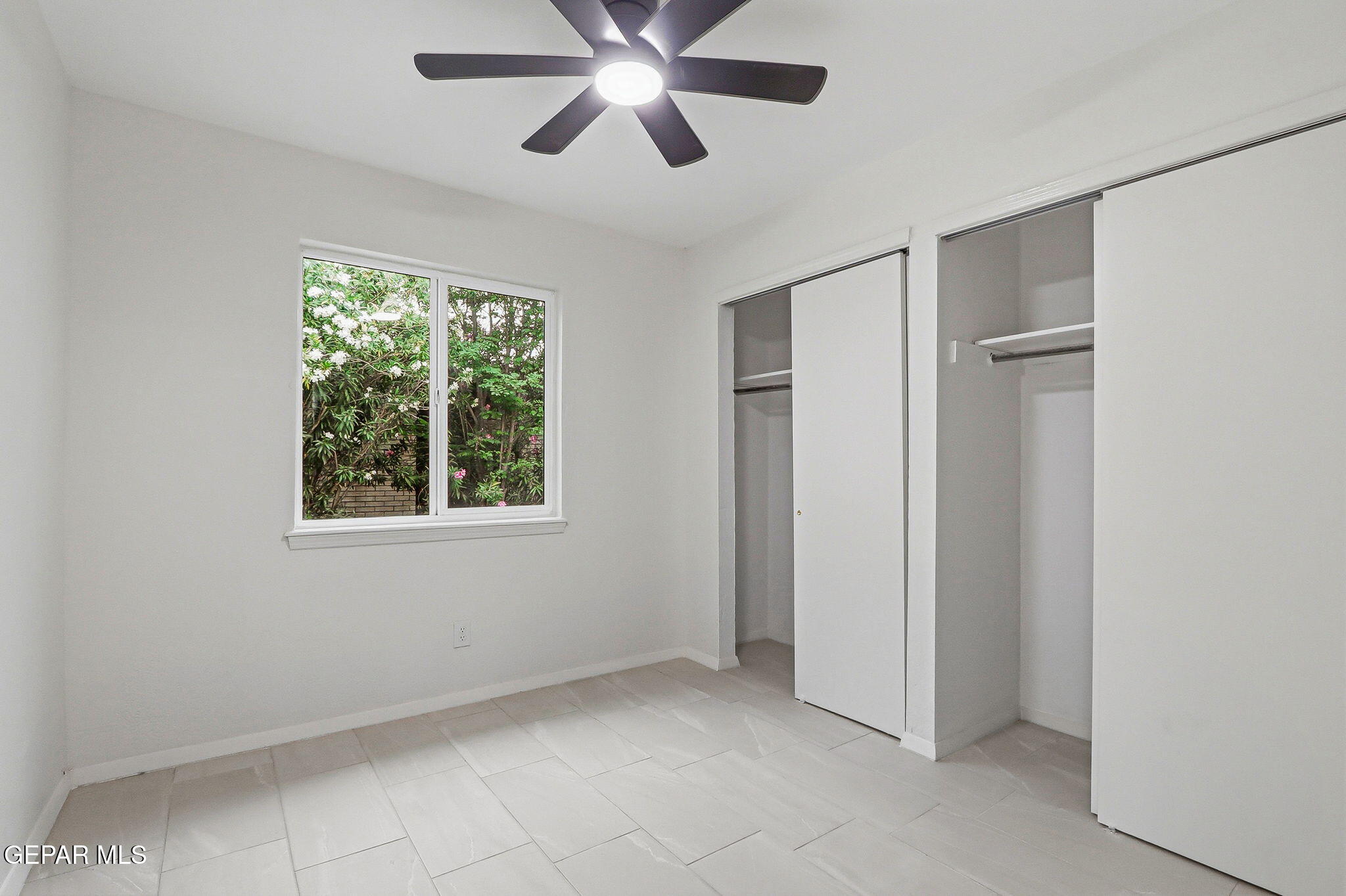 709 Frontera Road El Paso, TX 79922 - Photo 28 of 41 a view of an empty room with window and closet area