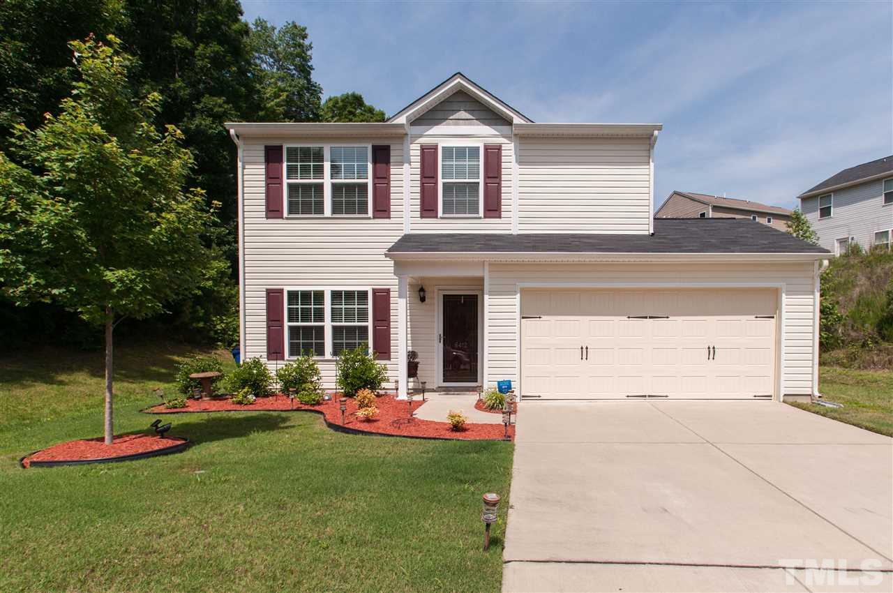 6412 Flanking Lane Raleigh, NC 27610 - Photo 1 of 22 a front view of a house with a yard and porch