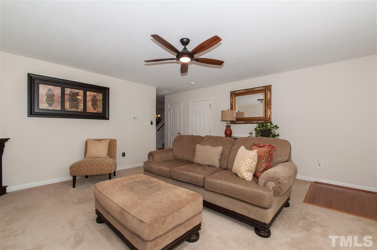 6412 Flanking Lane Raleigh, NC 27610 - Photo 2 of 22 a living room with furniture and a ceiling fan