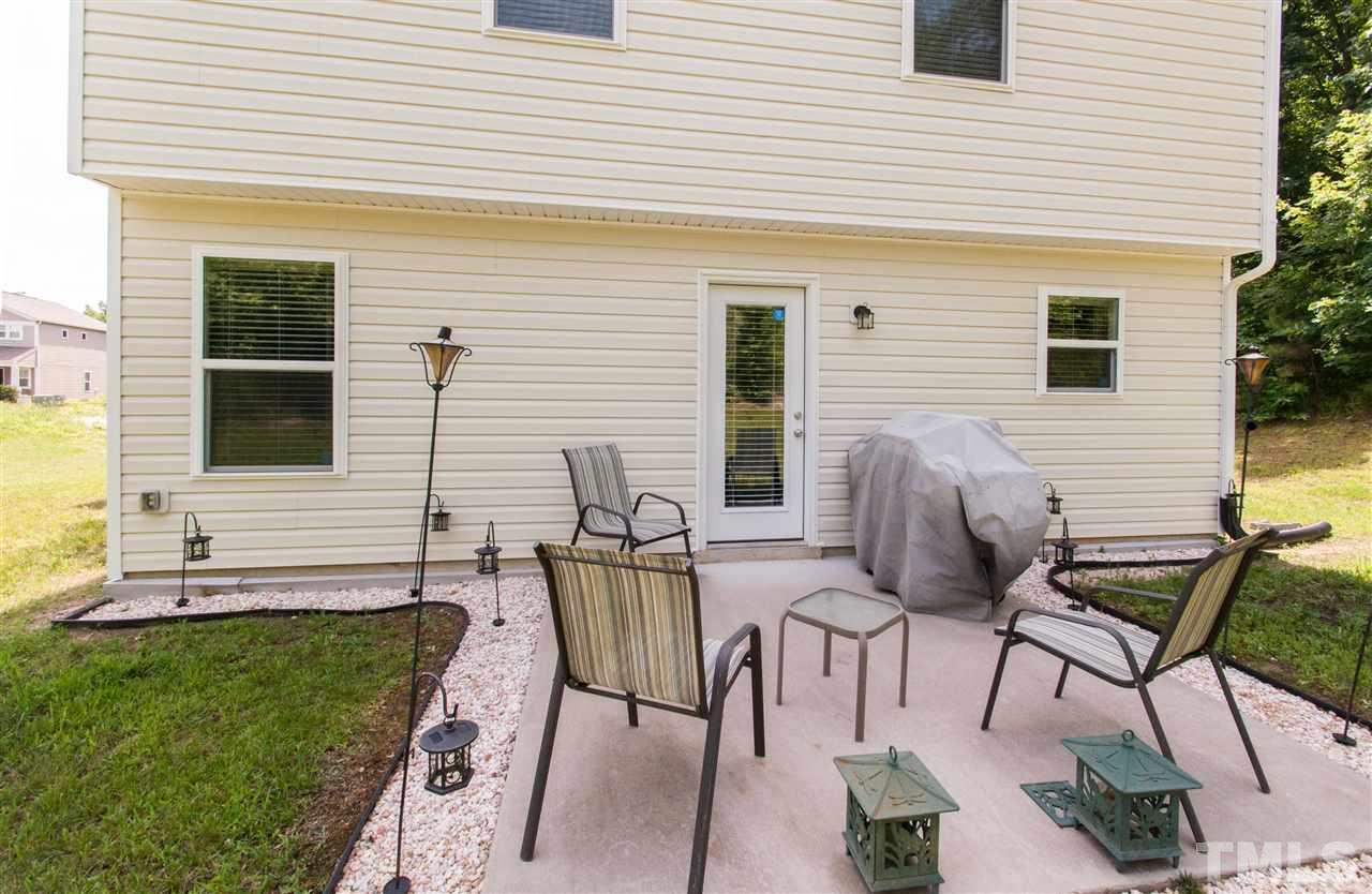 6412 Flanking Lane Raleigh, NC 27610 - Photo 16 of 22 a view of a house with backyard and sitting area