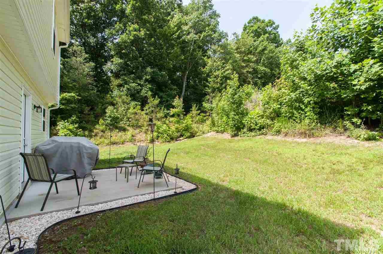6412 Flanking Lane Raleigh, NC 27610 - Photo 17 of 22 a view of a chairs and table in the garden