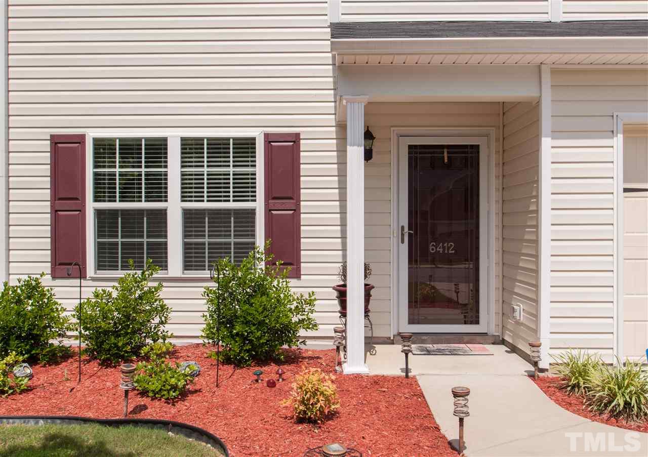 6412 Flanking Lane Raleigh, NC 27610 - Photo 18 of 22 a front view of a house with a yard