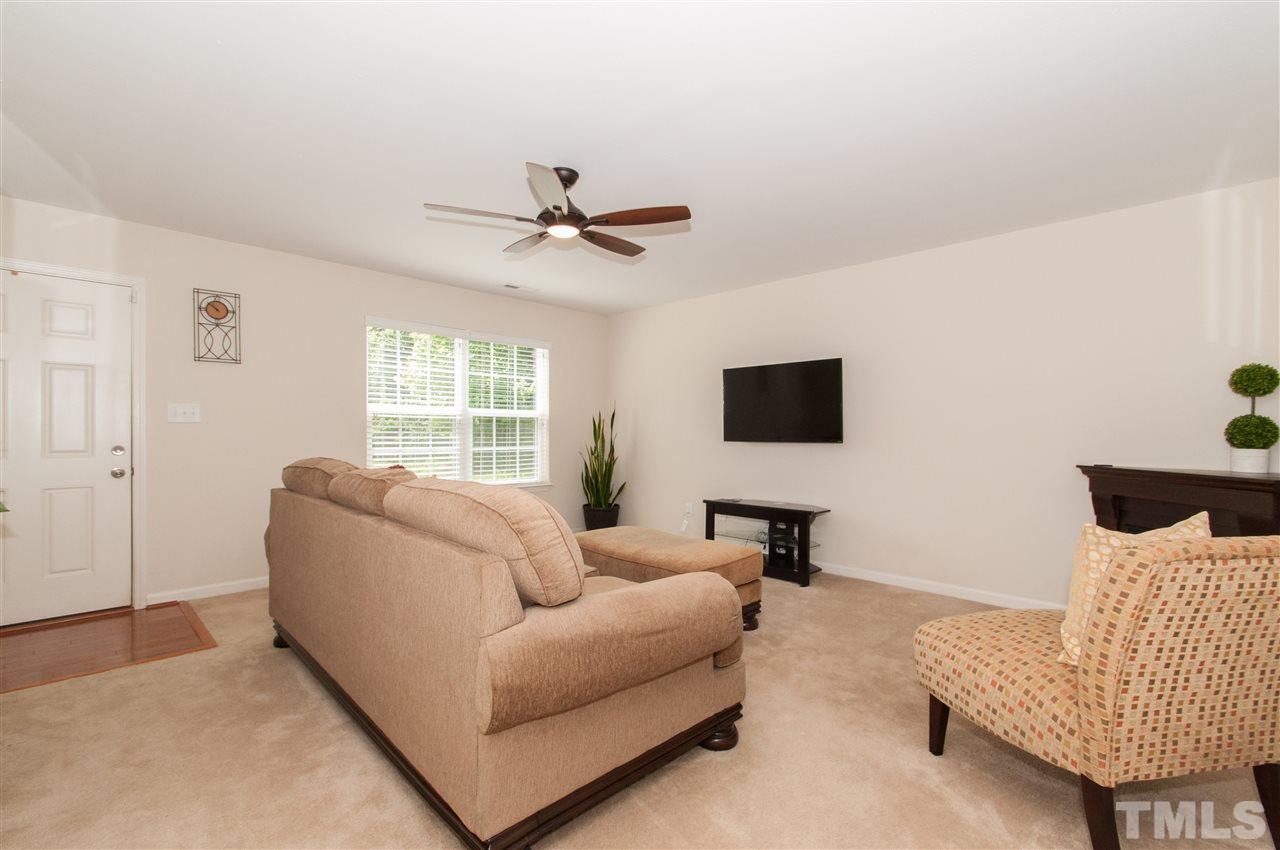 6412 Flanking Lane Raleigh, NC 27610 - Photo 4 of 22 a living room with furniture and a flat screen tv