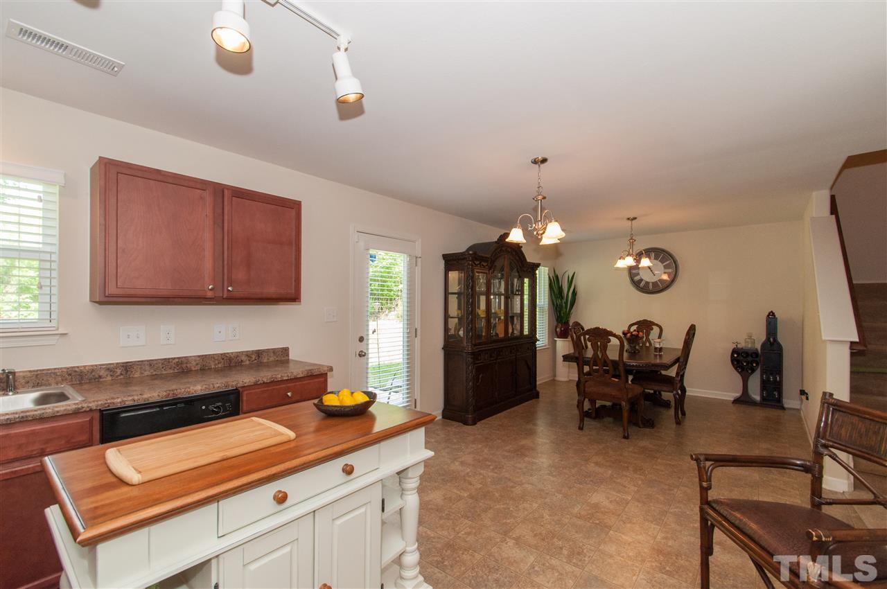 6412 Flanking Lane Raleigh, NC 27610 - Photo 7 of 22 a kitchen with a table and chairs in it
