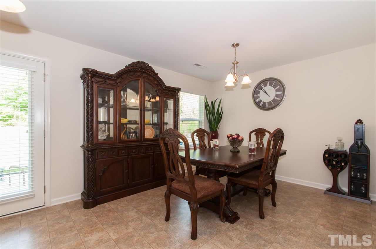 6412 Flanking Lane Raleigh, NC 27610 - Photo 8 of 22 a view of a dining room and chairs