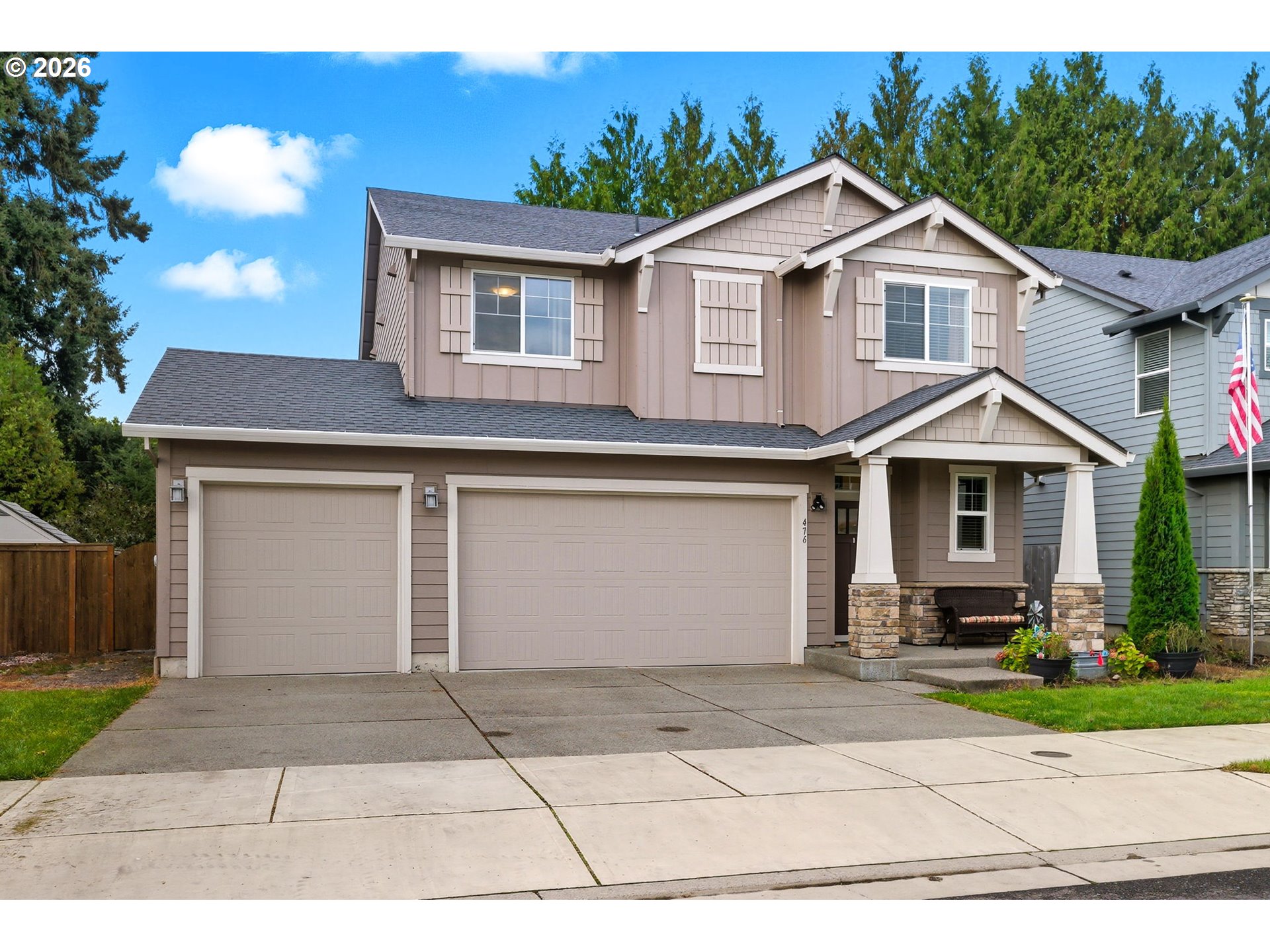 476 Southwest 15th Avenue Canby, OR 97013 - Photo 3 of 41 a front view of a house with a yard and garage