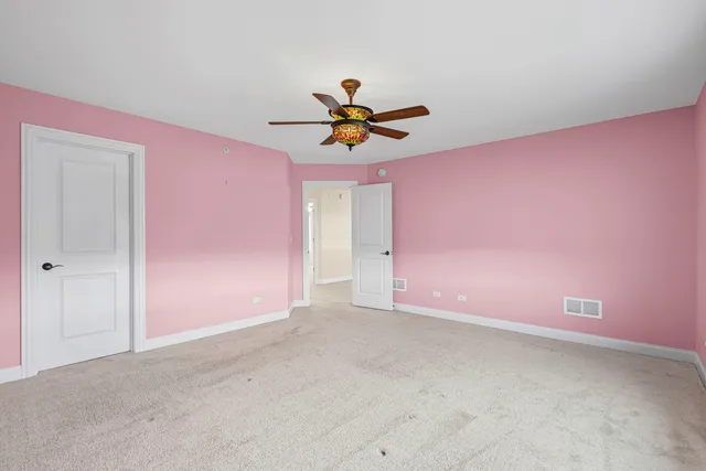 a view of a big room with windows